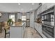 Kitchen island with granite countertops and breakfast bar at 15292 Mille Fiore Blvd, Port Charlotte, FL 33953