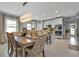 Kitchen with island, table, and stainless steel appliances at 15292 Mille Fiore Blvd, Port Charlotte, FL 33953