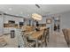 Open concept kitchen with island and dining area at 15292 Mille Fiore Blvd, Port Charlotte, FL 33953