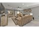 Spacious living area featuring comfortable sofas and a fireplace at 15292 Mille Fiore Blvd, Port Charlotte, FL 33953
