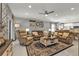 Relaxing living room with comfortable seating and a large TV at 15292 Mille Fiore Blvd, Port Charlotte, FL 33953