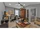 Home office with built-in cabinet and comfortable seating at 15292 Mille Fiore Blvd, Port Charlotte, FL 33953