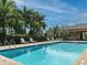 Community pool with lounge chairs and shaded areas at 15292 Mille Fiore Blvd, Port Charlotte, FL 33953
