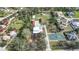 Aerial view of property showing house, outbuildings, and pickleball court at 1931 Bayshore Dr, Englewood, FL 34223