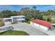 Aerial view of house, detached garage, and large driveway at 1931 Bayshore Dr, Englewood, FL 34223