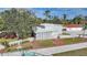 Gray house with white lattice and fountain at 1931 Bayshore Dr, Englewood, FL 34223