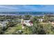 Aerial view of property with house, outbuildings, and pickleball court at 1931 Bayshore Dr, Englewood, FL 34223