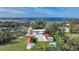 Aerial view of property showing house, outbuildings, and pickleball court at 1931 Bayshore Dr, Englewood, FL 34223