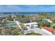 Aerial view of house, outbuildings, pickleball court, and waterfront at 1931 Bayshore Dr, Englewood, FL 34223