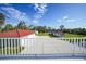 Property features a large yard, detached garage and shed at 1931 Bayshore Dr, Englewood, FL 34223
