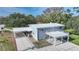 Aerial view of house showcasing deck and carport at 1931 Bayshore Dr, Englewood, FL 34223