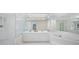 Spa-like bathroom with double sinks and large shower at 1931 Bayshore Dr, Englewood, FL 34223