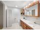 Bathroom with double sinks, large mirror, and ample storage at 1931 Bayshore Dr, Englewood, FL 34223