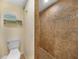 Bathroom with a walk-in shower and pebble flooring at 1931 Bayshore Dr, Englewood, FL 34223
