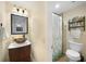 Clean bathroom with a brown vessel sink and shower/tub combo at 1931 Bayshore Dr, Englewood, FL 34223