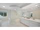 Elegant bathroom with double vanity and walk-in shower at 1931 Bayshore Dr, Englewood, FL 34223
