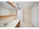 Bathroom features double sinks and a large medicine cabinet at 1931 Bayshore Dr, Englewood, FL 34223