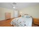 Bright bedroom with wood flooring and ceiling fan at 1931 Bayshore Dr, Englewood, FL 34223