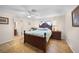 Bright bedroom with a wooden bed frame and ensuite bathroom access at 1931 Bayshore Dr, Englewood, FL 34223