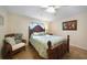 Guest bedroom with a comfortable bed and wicker accent chair at 1931 Bayshore Dr, Englewood, FL 34223