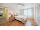 Cozy bedroom with wood flooring and ceiling fan at 1931 Bayshore Dr, Englewood, FL 34223