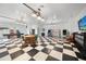 Fun game room featuring a pool table, arcade games, and a checkerboard floor at 1931 Bayshore Dr, Englewood, FL 34223