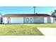 Attached garage with barn doors and additional storage at 1931 Bayshore Dr, Englewood, FL 34223