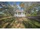 White gazebo with red tile roof nestled in the backyard at 1931 Bayshore Dr, Englewood, FL 34223