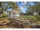 White gazebo with red tile roof and stone path nearby at 1931 Bayshore Dr, Englewood, FL 34223