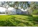House with deck, stairs, and screened enclosure at 1931 Bayshore Dr, Englewood, FL 34223