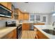 Modern kitchen with stainless steel appliances and light wood cabinets at 1931 Bayshore Dr, Englewood, FL 34223
