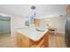 Kitchen island with breakfast bar seating and a double sink at 1931 Bayshore Dr, Englewood, FL 34223