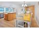 Kitchen features an island, light wood cabinets, and stainless steel appliances at 1931 Bayshore Dr, Englewood, FL 34223