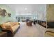 Spacious living room with a large stone fireplace and ample natural light at 1931 Bayshore Dr, Englewood, FL 34223