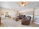 Relaxing living room with leather furniture and a view of the staircase at 1931 Bayshore Dr, Englewood, FL 34223