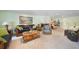 Comfortable living room with a stone fireplace and built-in bookcase at 1931 Bayshore Dr, Englewood, FL 34223