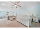 Main bedroom with king-size bed and sitting area at 1931 Bayshore Dr, Englewood, FL 34223