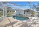 Relaxing kidney-shaped pool with patio at 1931 Bayshore Dr, Englewood, FL 34223