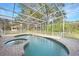 Inviting pool and spa with screened enclosure at 1931 Bayshore Dr, Englewood, FL 34223
