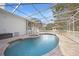 Inviting pool and spa with covered lanai at 1931 Bayshore Dr, Englewood, FL 34223
