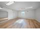 Bright studio with wood flooring and large mirror at 1931 Bayshore Dr, Englewood, FL 34223