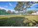 Private tennis court nestled amongst lush landscaping at 1931 Bayshore Dr, Englewood, FL 34223