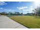Private tennis court with green surface and surrounding fence at 1931 Bayshore Dr, Englewood, FL 34223