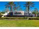 Del Webb Cypress Falls community entrance with fountain and landscaping at 2427 Daisy Dr, North Port, FL 34289