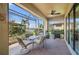 Outdoor patio with seating and screened enclosure at 2427 Daisy Dr, North Port, FL 34289