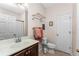Simple bathroom with a vanity, toilet, and shower at 24490 Wallaby Ln, Punta Gorda, FL 33955
