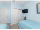 Guest bedroom with twin beds, built in closet and TV at 24490 Wallaby Ln, Punta Gorda, FL 33955