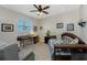Bright bedroom with a daybed, desk, and window offering natural light at 24490 Wallaby Ln, Punta Gorda, FL 33955