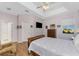 Main bedroom with a king-size bed, dresser and en-suite access at 24490 Wallaby Ln, Punta Gorda, FL 33955