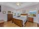 Main bedroom featuring a wooden bed frame and lots of natural light at 24490 Wallaby Ln, Punta Gorda, FL 33955